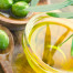 Extra virgin healthy Olive oil with fresh olives on rustic wooden background